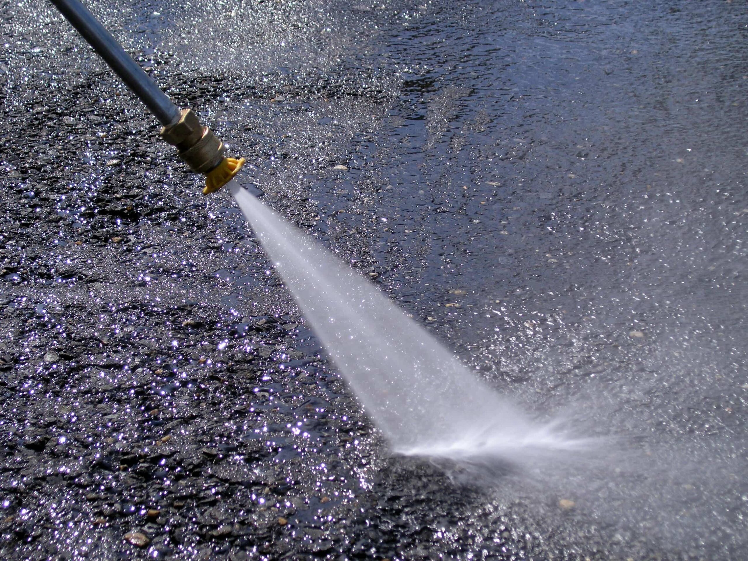 Pressure washing machine in action, up close.